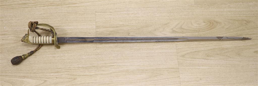 A George V Naval officers sword, by J R Gaunt & Son, Serial No. 16427 together with scabbard and leather case
